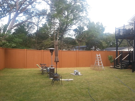 Fence staining with solid wood stain.